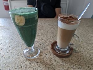 Spirulina smoothie and cappuccino at Leaves Cafe in Cotovia
