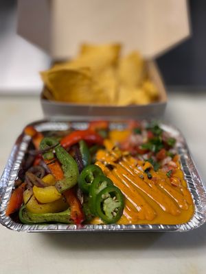 Queso fundido with a protein & side of corn chips. Find it under Queso Fundido & Totopos. at Luna Verde Vegan Mexican Restaurant in Bradley Beach