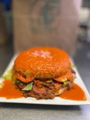 ChoriTorta smothered in salsa ranchera. at Luna Verde Vegan Mexican Restaurant in Bradley Beach