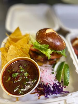 An experience to have and behold! Homemade Birria Burger with consomé and fixings.
Made with our own simple ingredients and seasoning.  at Luna Verde Vegan Mexican Restaurant in Bradley Beach