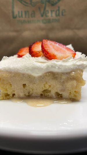 T R E S   L E C H E S  Cake Homestyle. Luna Verde’s vanilla sponge cake lusciously drenched in sweet vegan milks, topped with smooth whipped cream and sliced strawberries.  at Luna Verde Vegan Mexican Restaurant in Bradley Beach