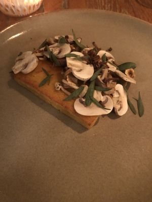 Tofu main course with mixed mushrooms and green veg at Titchwell Manor in Titchwell