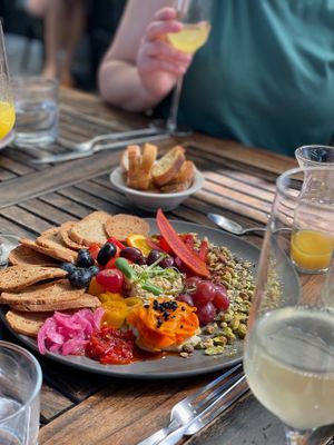 Vegan charcuterie plate--House-Smoked Carrot Lox (v) Miyoko's Mozzarella (v), House-Made Cashew Burrata (v), crostini, accoutrement at Revolution Winery and Kitchen in Sacramento
