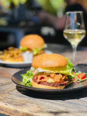 Jammin' burger: Impossible patty, lettuce, crispy onions, pepper jam, aioli, house-made vegan cashew burrata, Acme vegan bun, fries (v)(*gf) at Revolution Winery and Kitchen in Sacramento