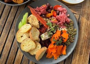Vegan charcuterie plate: House-Smoked Carrot Lox, Miyoko's Mozzarella, House-Made Cashew Burrata (v), crostini, accoutrement (*gf) at Revolution Winery and Kitchen in Sacramento