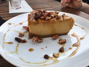 Pumpkin cheesecake with graham cracker crust and pecan crumble. at Revolution Winery and Kitchen in Sacramento