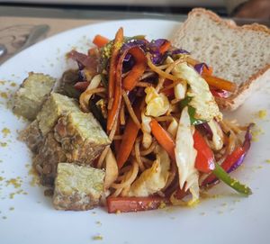 Spaghetti sin tacc, con vegetales salteados, especias y tempeh at Oli Veggie Food in Punta Del Este