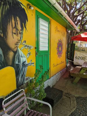 Terrace with murals at Freedom Fighters Ital Shack in Philipsburg