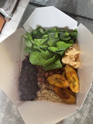 Bowl with beats, pinto beans, spinach, mullet, and cashew cheese and plantains   at Freedom Fighters Ital Shack in Philipsburg