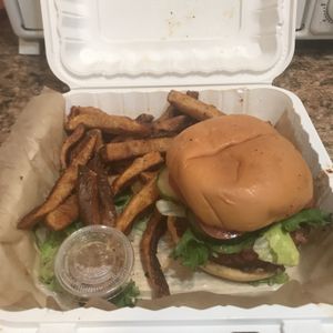Carry out order of The Underground burger and fries. You can also request Daiya cheese for the burger.  at Rock'n Dough Pizza in Jackson