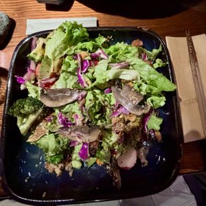 Grilled sweet potato, avocado, cauliflower and portobello mushroom on a salad of green leaves, red cabbage, quinoa, tomatoes, edamame, radish, broccoli and sesame topped with goma  at Sticks N Sushi in Copenhagen