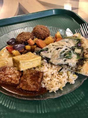 Falafel, tempeh, tofu, Baja rice, roasted veg and pesto pizza   at Green Cuisine Vegetarian Restaurant in Victoria