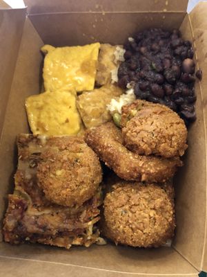 Vegan lasagna and potato cakes, falafels, tofu and beans  at Green Cuisine Vegetarian Restaurant in Victoria