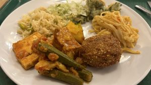 Quinoa cake, tofu, veg and cold salads  at Green Cuisine Vegetarian Restaurant in Victoria