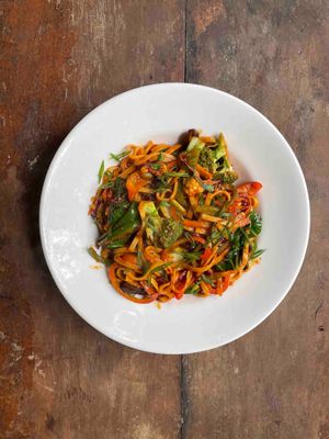 Drunken udon noodles in a chilly basil sauce with lots of veggies.  at Bean Me Up in Goa