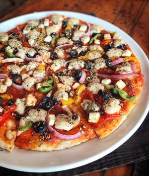 veggie pizza w vegan cheese yummm at Bean Me Up in Goa
