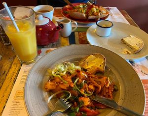 My vegan bacon hash, and my boyfriend’s avocado brunch   at Lounges - Otto Lounge  in Heswall