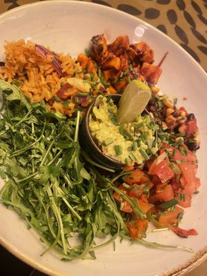 Superbowl, roasted sweet potato with guac, rocket, salsa and spicy rice   at Racconto Lounge  in Bury