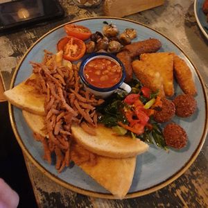 Big Vegan Breakfast: Veggie sausage, falafel, greens & peppers, hash browns, baked beans, roasted tomatoes, button mushrooms, vegan bacon and two slices of white or brown toast. at Unico Lounge  in Wilmslow