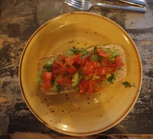 Vegan Smashed Avocado Brunch: Edamame guacamole, chipotle tomato salsa, Aleppo chilli, coriander and lime on toasted ciabatta. at Unico Lounge  in Wilmslow