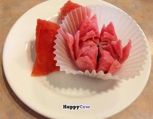 Lotus flower cake and watermelon chunks: Rice and wheat flour pastry with red bean paste and brown sugar filling. at Lotus Pond in Victoria
