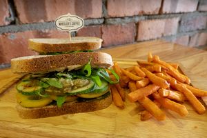 'I'm Vegan' sandwich with toasted sourdough bread, homemade pesto sauce, hummus, fresh tomato, cucumber, onion, rocket, avocado & sweet potato fries.  at Wheeler's Cafe in Penang