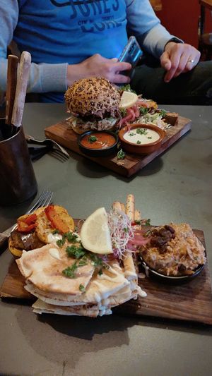The burger and 2nd course of tapas. at Bar d'Henri in Antwerpen