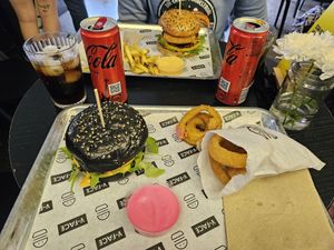 Hot Chick (charcoal bun) & onion rings with pink garlic mayo , Brunchie Burg & fries and burger sauce at V-Face in Dublin