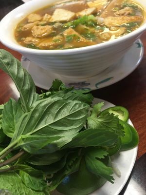 Spicy Vegan Soup with ham and tofu, beef, chicken and rice noodle at Pho Saigon Village Noodle House in Vallejo