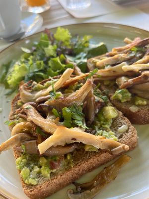 Avocado and mushrooms on toast😄 at Aubergine Cafe in Corfu