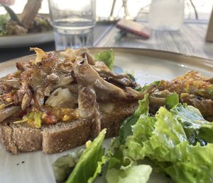Toast with Avocado spread + mushrooms  at Aubergine Cafe in Corfu
