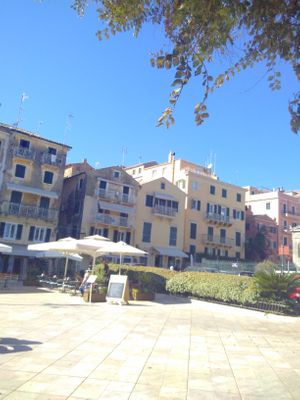 A view of the cafe and plaza seating area. at Aubergine Cafe in Corfu