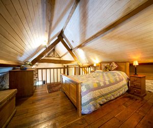 Rustic cottage bedroom at Robins Realm in Carmarthen