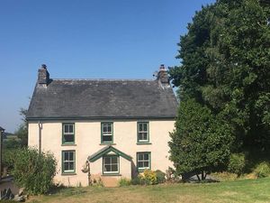 Victorian no-meat farmhouse with vintage interior, several fireplaces, huge kitchen, disabled friendly, hot tub, acres of garden, games room, eco friendly and with a cat called Chick Pea! Sleeps 11 at Robins Realm in Carmarthen