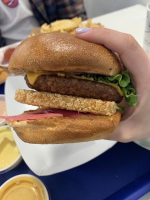 Omega burger with pickled onion  at Meta Burger in Denver