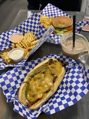 Philliy, supernova burger, fries with ranch and meta sauce, chocolate shake, and sugar cookie  at Meta Burger in Denver