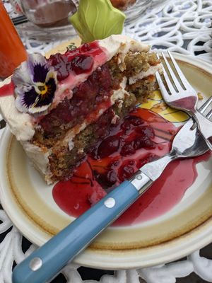 Such an incredible slice of cake. Golden beet cake with almond cream cheese frosting, and a sour cherry sauce. at Fog Eater Cafe in Mendocino