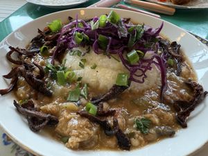 GRITS AND GRILLADES
creole Gravy + oyster mushroom bacon + blackeyed pea sausage  at Fog Eater Cafe in Mendocino