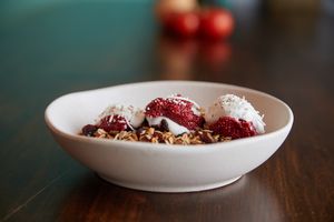 Toasty trusty oats & seeds topped w fruit, coconut yoghurt & your choice of milk at Yalla Yalla in Hamilton