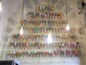 Wall decorated with variety of ice cream cones at Aima Ice Cream in Amman