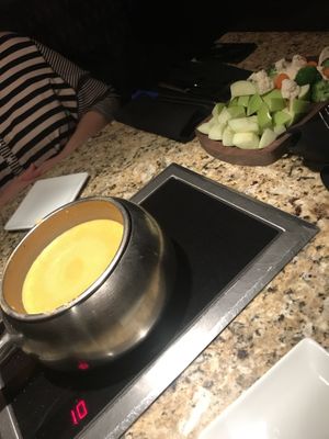 Vegan (Follow Your Heart) cheese fondue with apples, broccoli, cauliflower, and carrots at The Melting Pot in White Plains