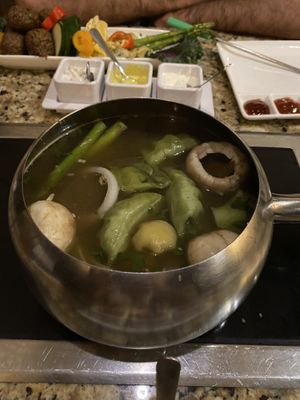 Cooking our entree in the Caribbean inspired broth!  at The Melting Pot in White Plains