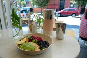 The windows open allowing the cafe to feel quite light and airy. at The Butcher's Daughter in Brooklyn