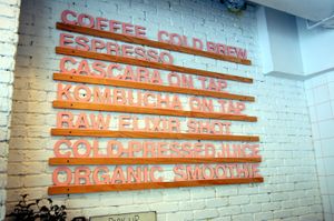 There's a bakery and coffee shop next door. at The Butcher's Daughter in Brooklyn