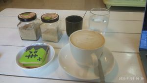 Hazelnut soy milk latte with vegan cookies at Biscotti House in Chiang Mai