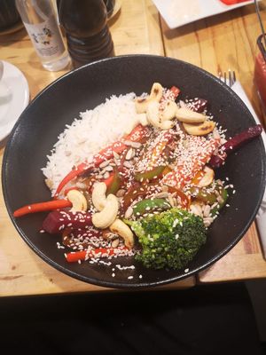 Asian wok dish with rice, sauce, cashews, two pieces of broc (requested more), carrot, Beetroot, paprika, sesame. at Herbs & Honey in Gyumri