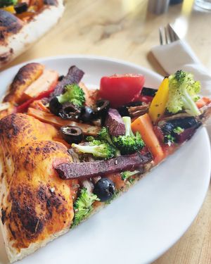 Veganized pizza, ask to omit cheese. Much of topping, really hearty. The pieces of beetroot on the pizza is rather cool thing, I liked it.  at Herbs & Honey in Gyumri