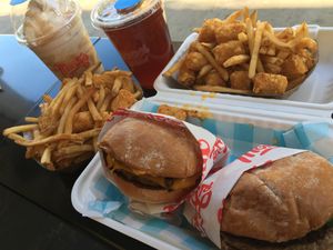 (2) single patty burgers w/ fries & tots (50/50), salted caramel shake, & ice tea at Monty's Good Burger in Riverside