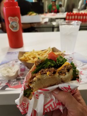Their plant-based burger with their julienne fries in the back and their ranch dipping sauce on the side. at Monty's Good Burger in Riverside