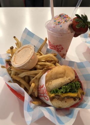 Cheeseburger & fries with strawberry shake at Monty's Good Burger in Riverside